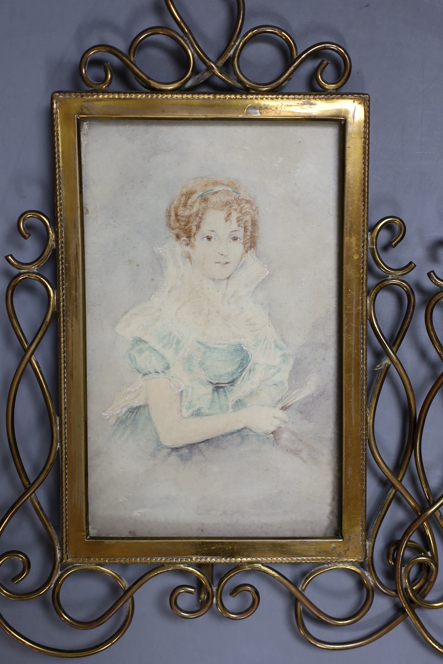 English School c.1900, pair of watercolour, Portraits of ladies, 15 x 9.5cm, housed in brass scroll frames